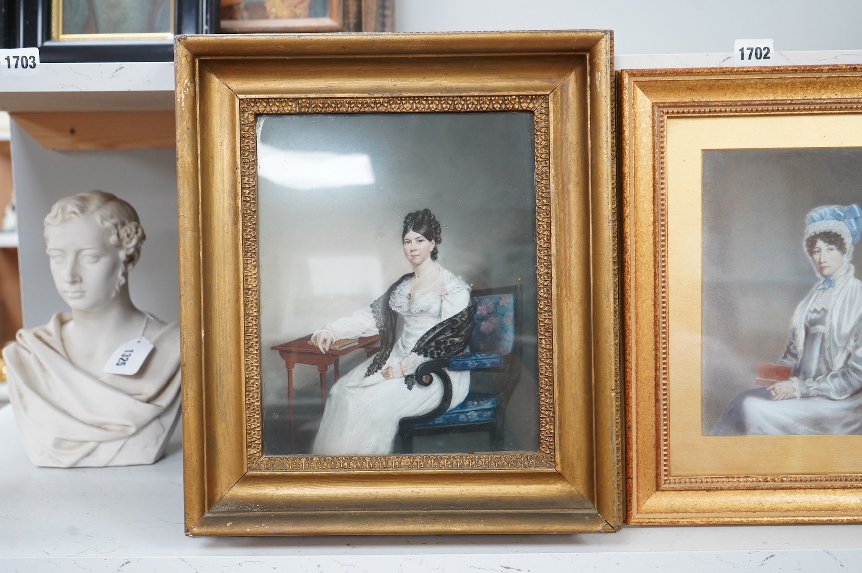 Regency School, Portraits of seated ladies, unsigned, two watercolours on card, largest 26 x 21cm, each gilt framed